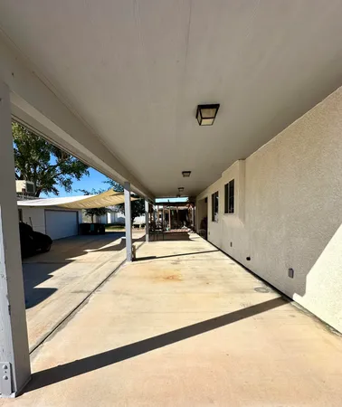 a swimming pool with a large window and yard