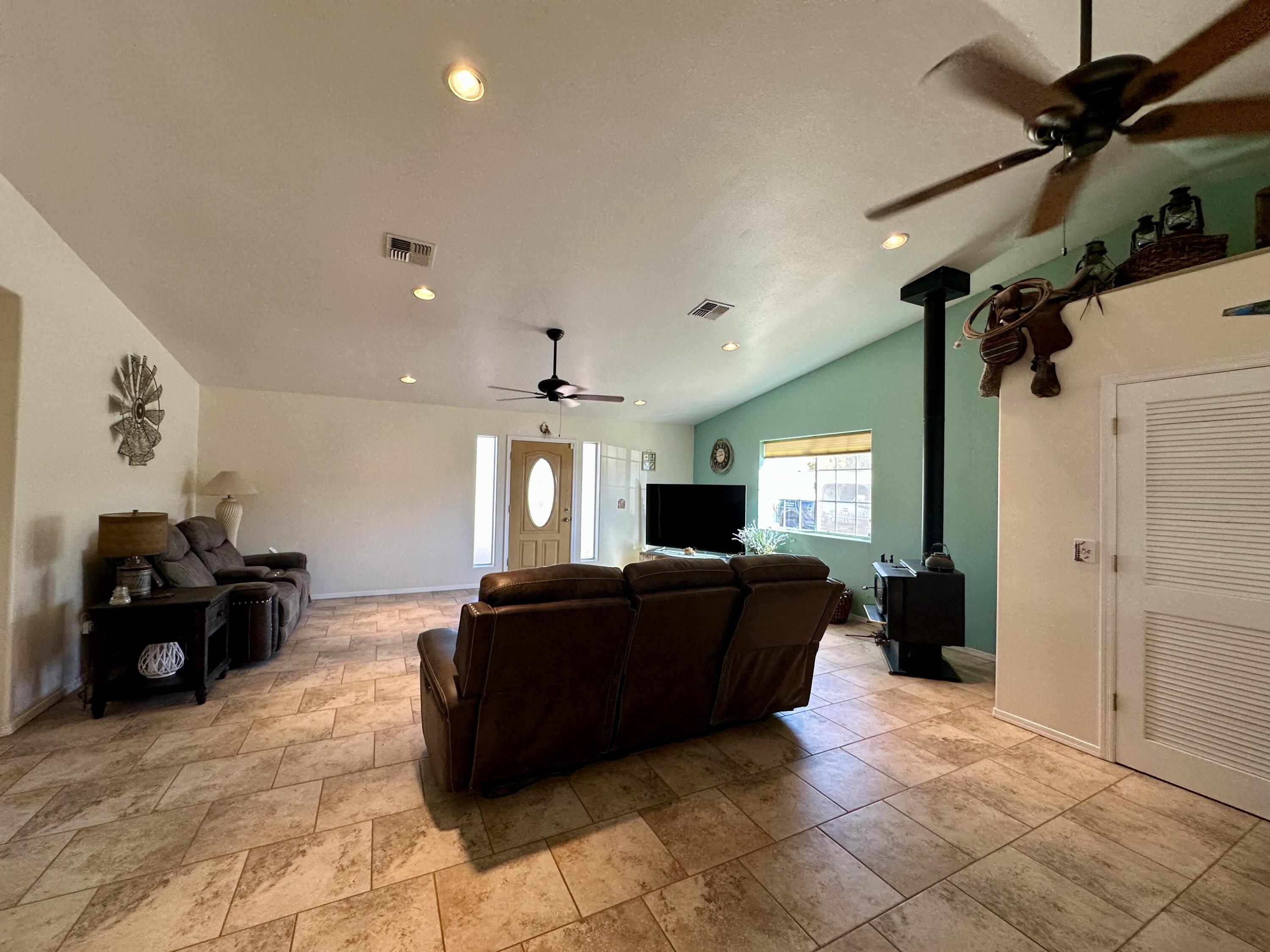 1731 Riviera Drive Blythe, CA 92225 - Photo 3 of 36 a living room with furniture and a flat screen tv