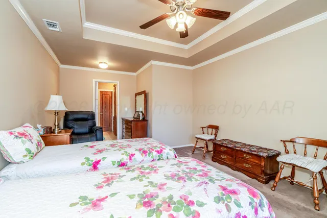 a bedroom with bed and windows