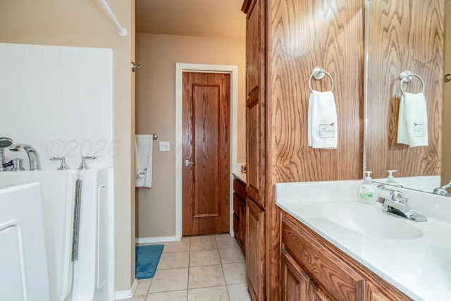a bathroom with a sink and a shower curtain