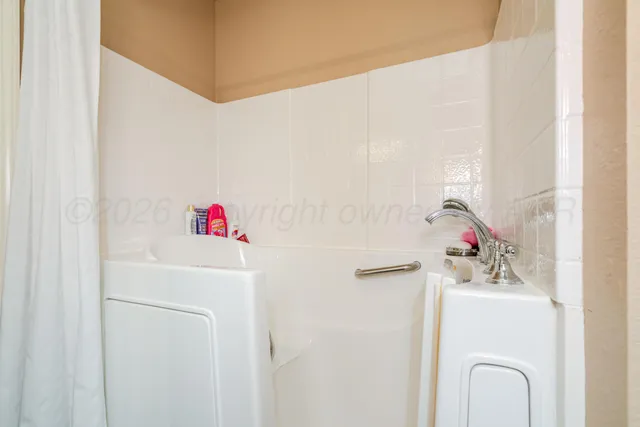 a bathroom with a toilet and a sink