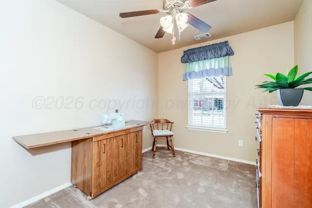 a view of a chairs and table in the backyard