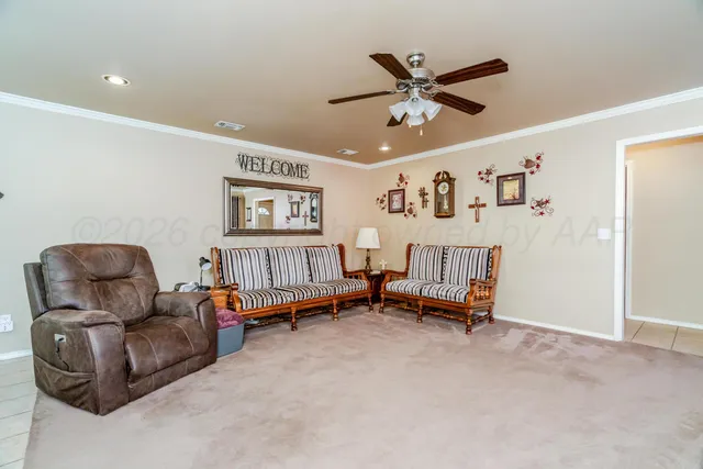 a kitchen with stainless steel appliances a table and chairs in it