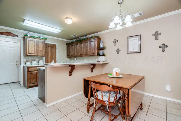 a kitchen with sink cabinets and appliances