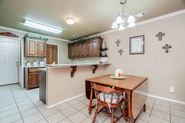 a kitchen with sink cabinets and appliances