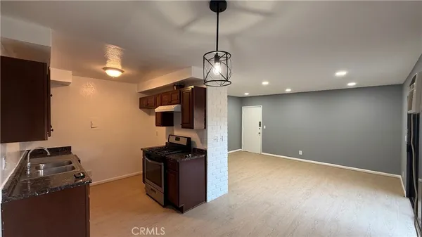 a view of a room with a flat screen tv