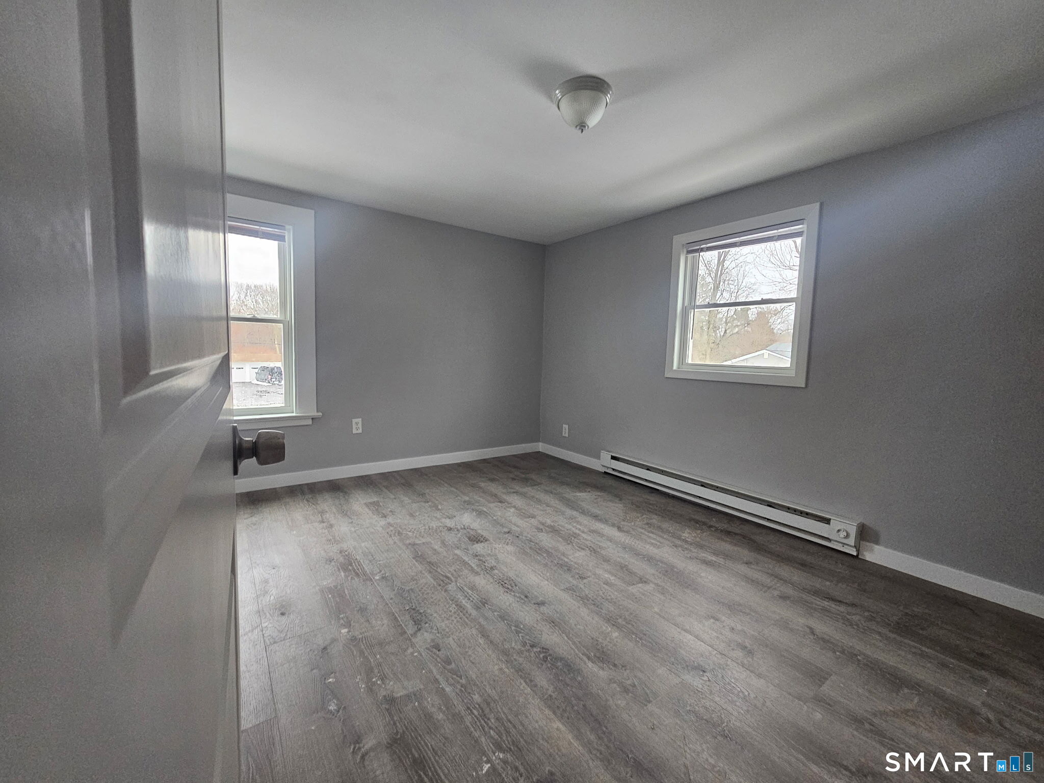 35 Morris Road Prospect, CT 06712 - Photo 14 of 19 an empty room with wooden floor and windows