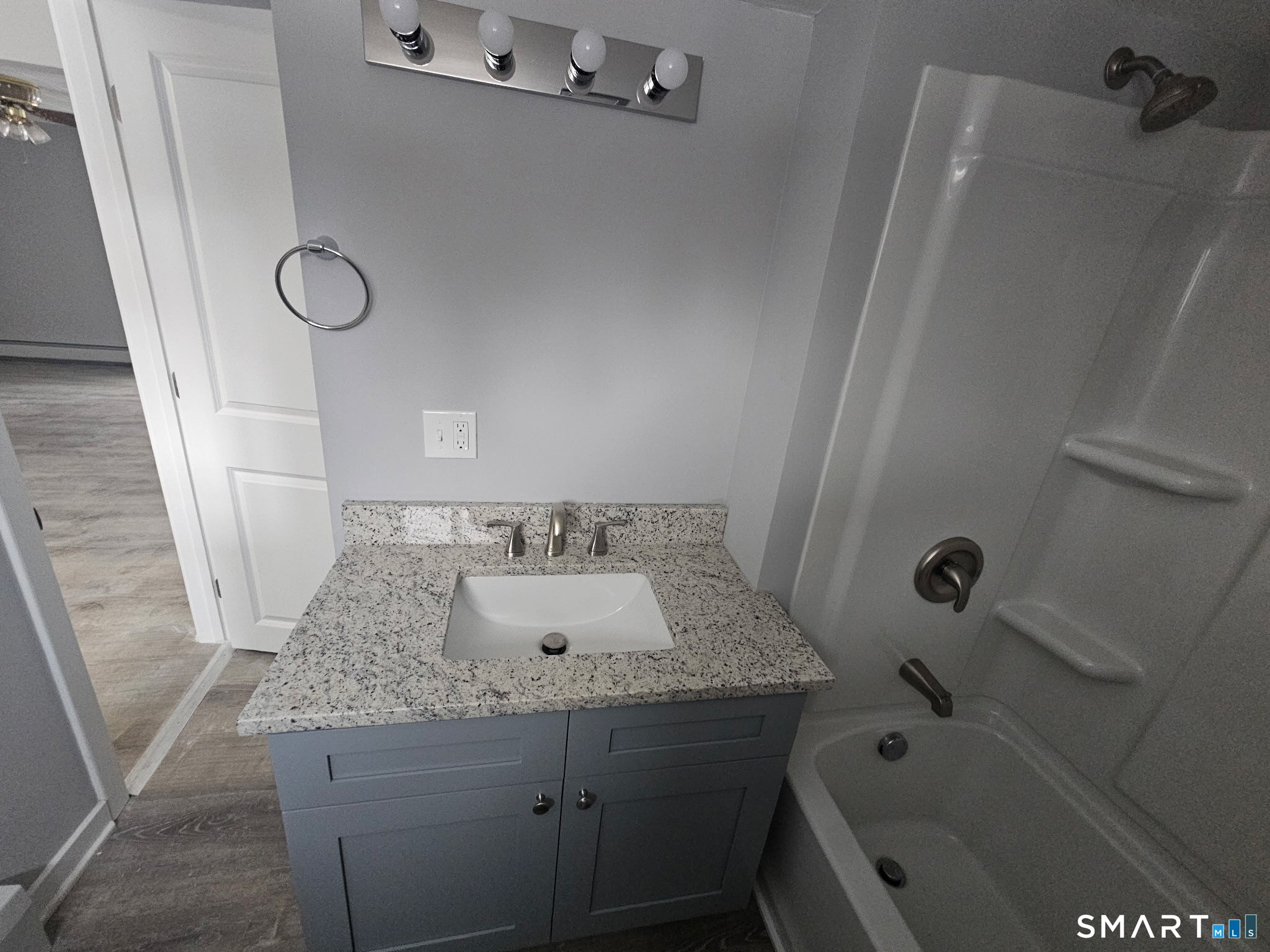 35 Morris Road Prospect, CT 06712 - Photo 3 of 19 a bathroom with a granite countertop sink and mirror with bathtub