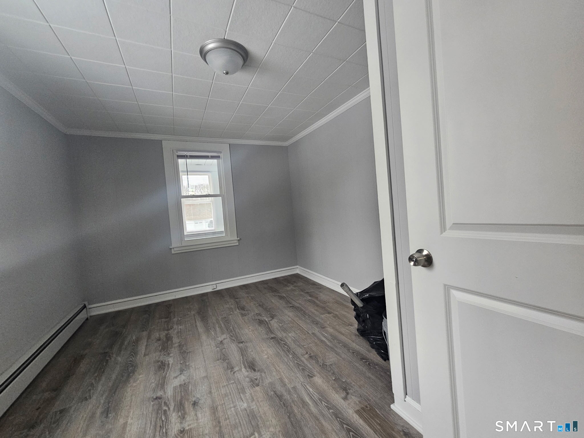 35 Morris Road Prospect, CT 06712 - Photo 5 of 19 a view of an empty room with wooden floor and a window