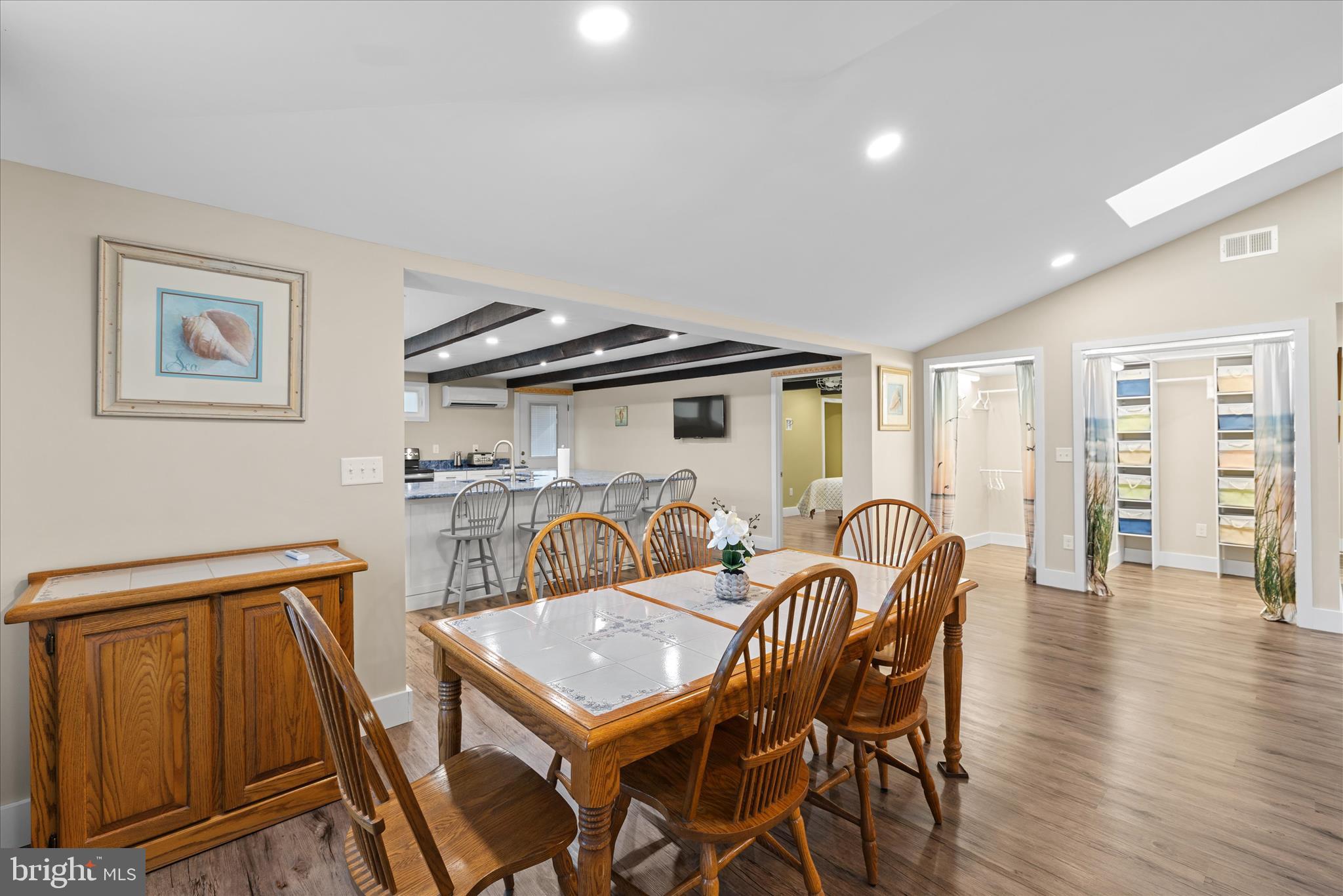 2 Bridge Road Bethany Beach, DE 19930 - Photo 11 of 65 a view of a dining room with furniture and wooden floor