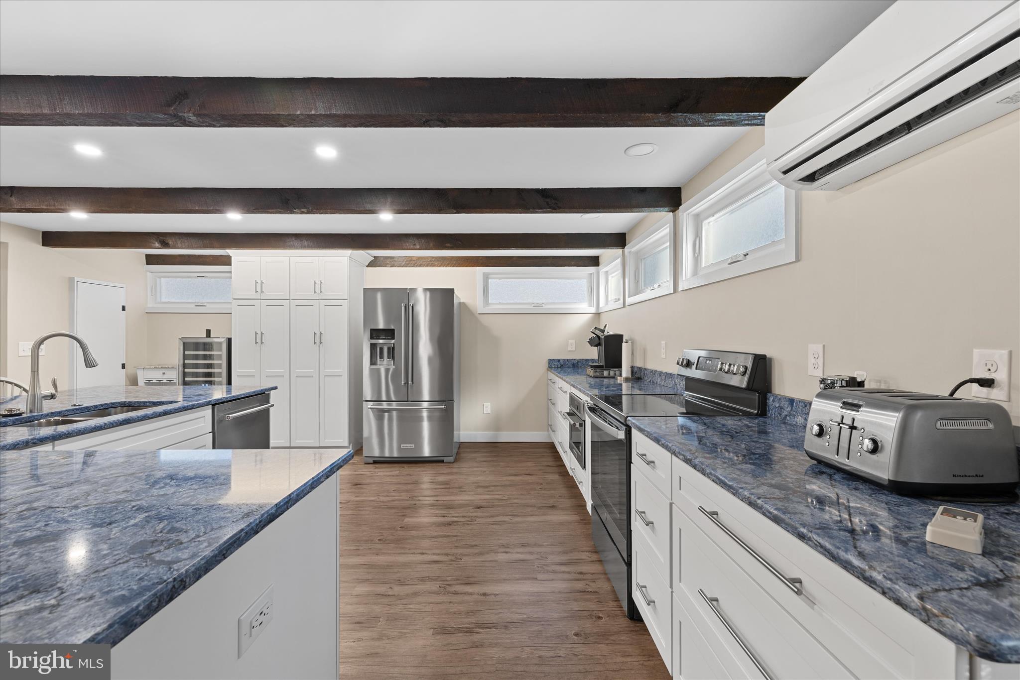 2 Bridge Road Bethany Beach, DE 19930 - Photo 18 of 65 a kitchen with stainless steel appliances granite countertop a sink and stove
