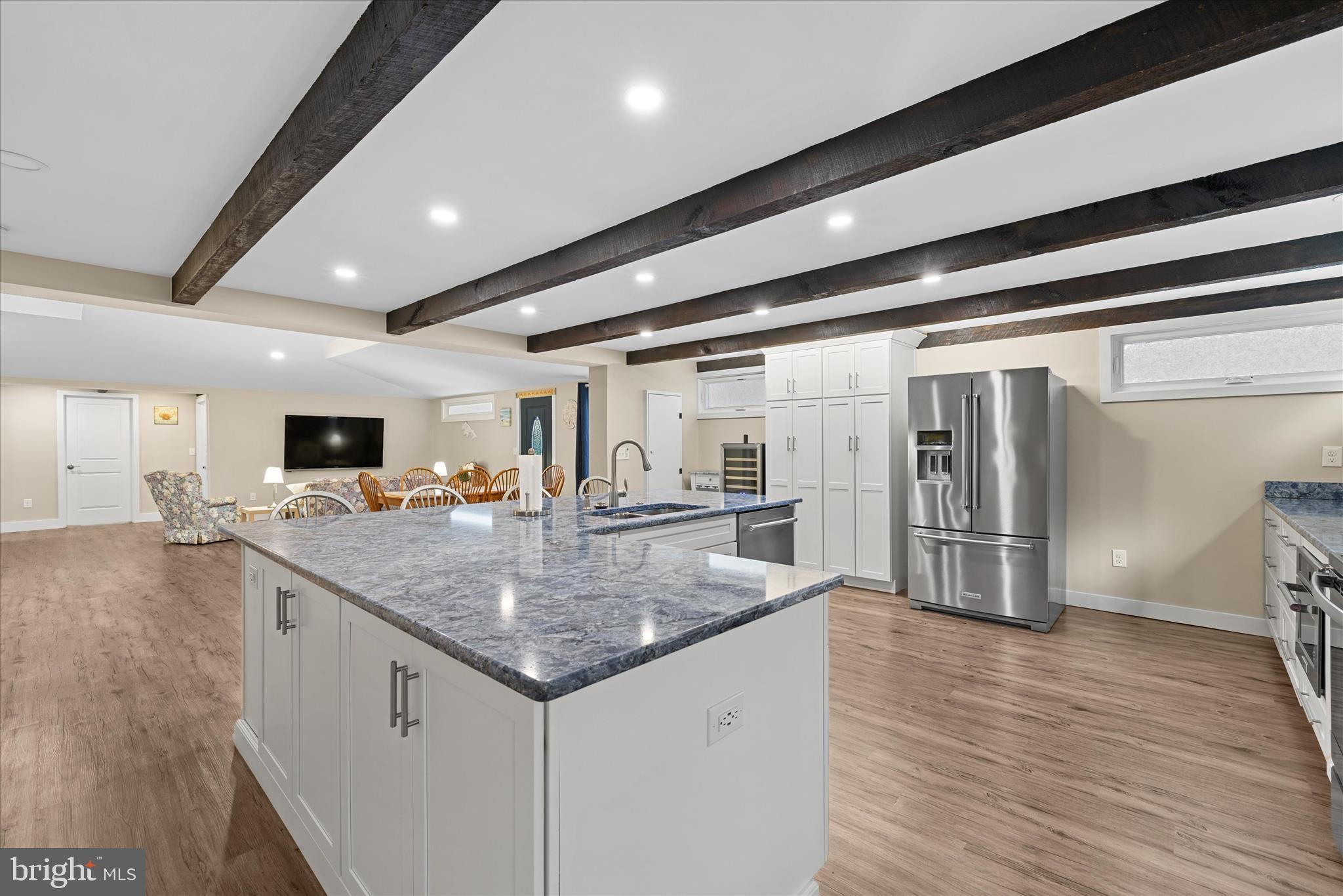 2 Bridge Road Bethany Beach, DE 19930 - Photo 19 of 65 a kitchen with stainless steel appliances granite countertop a sink and refrigerator