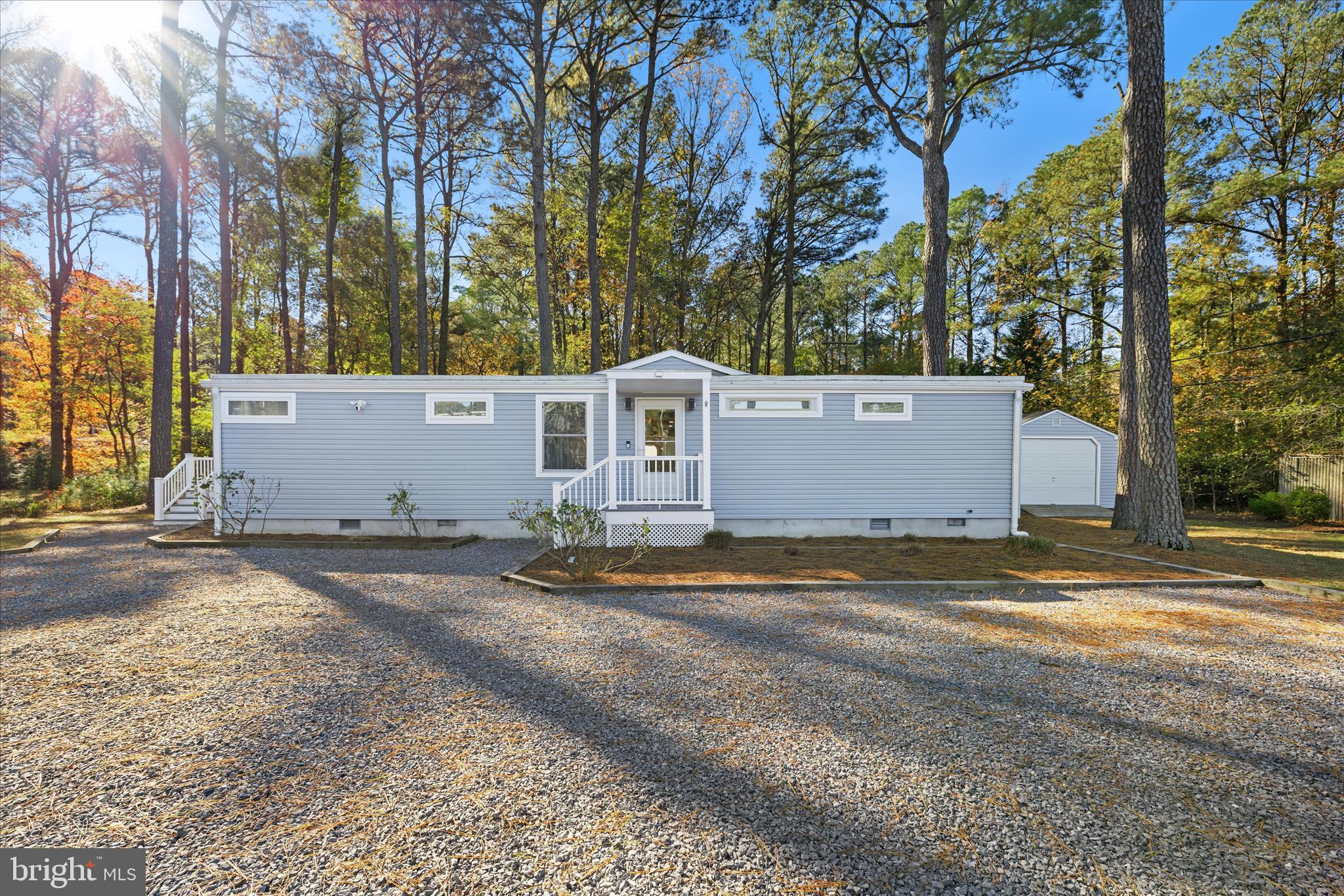 2 Bridge Road Bethany Beach, DE 19930 - Photo 2 of 65 a view of a house with a yard and garage