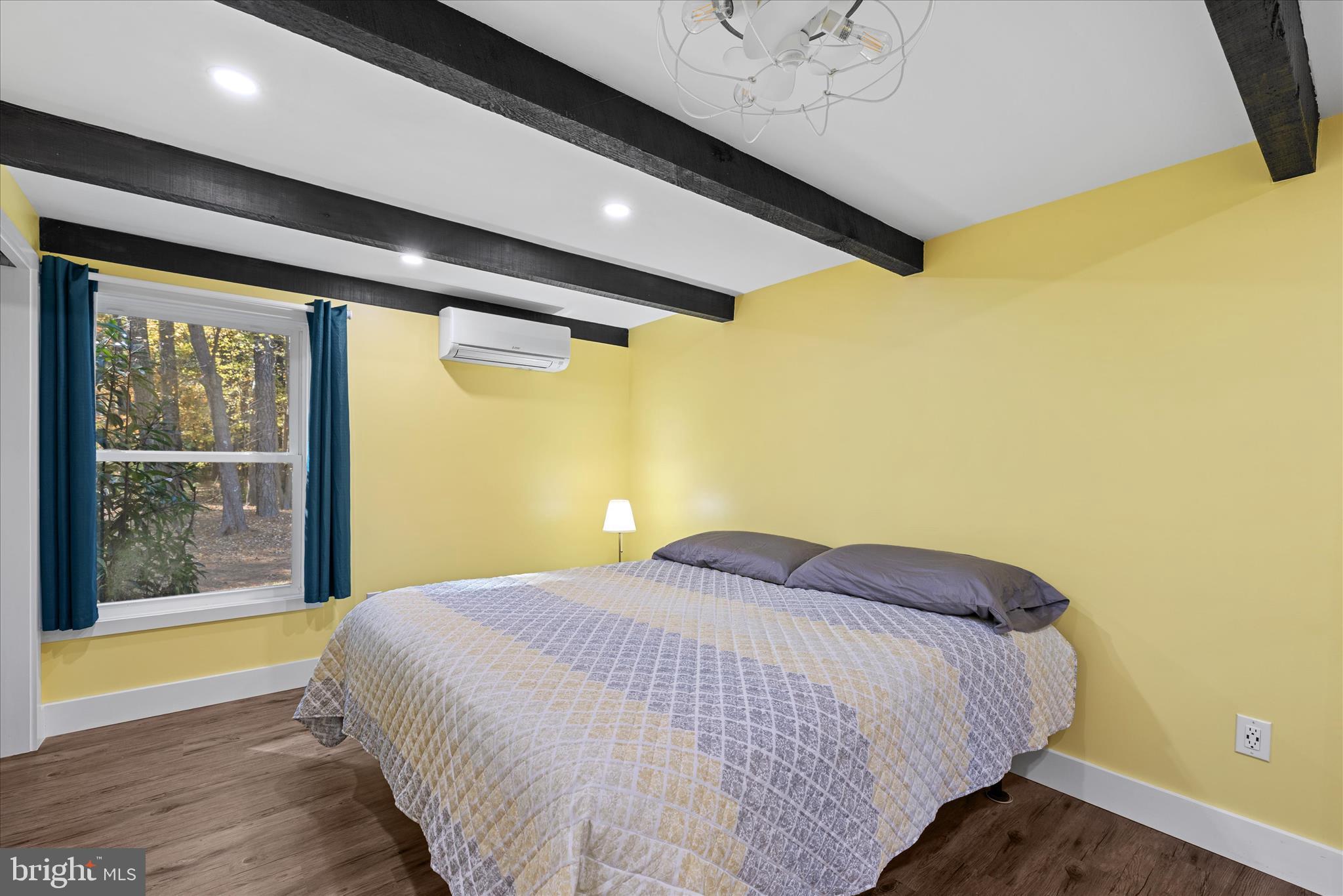 2 Bridge Road Bethany Beach, DE 19930 - Photo 21 of 65 a bedroom with a bed and wooden floor