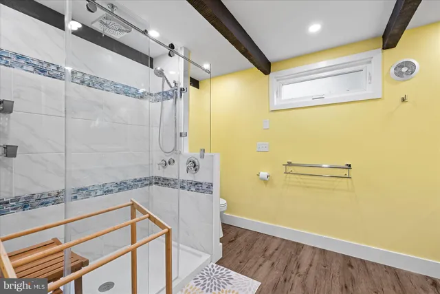 a bedroom with a large bed and a window