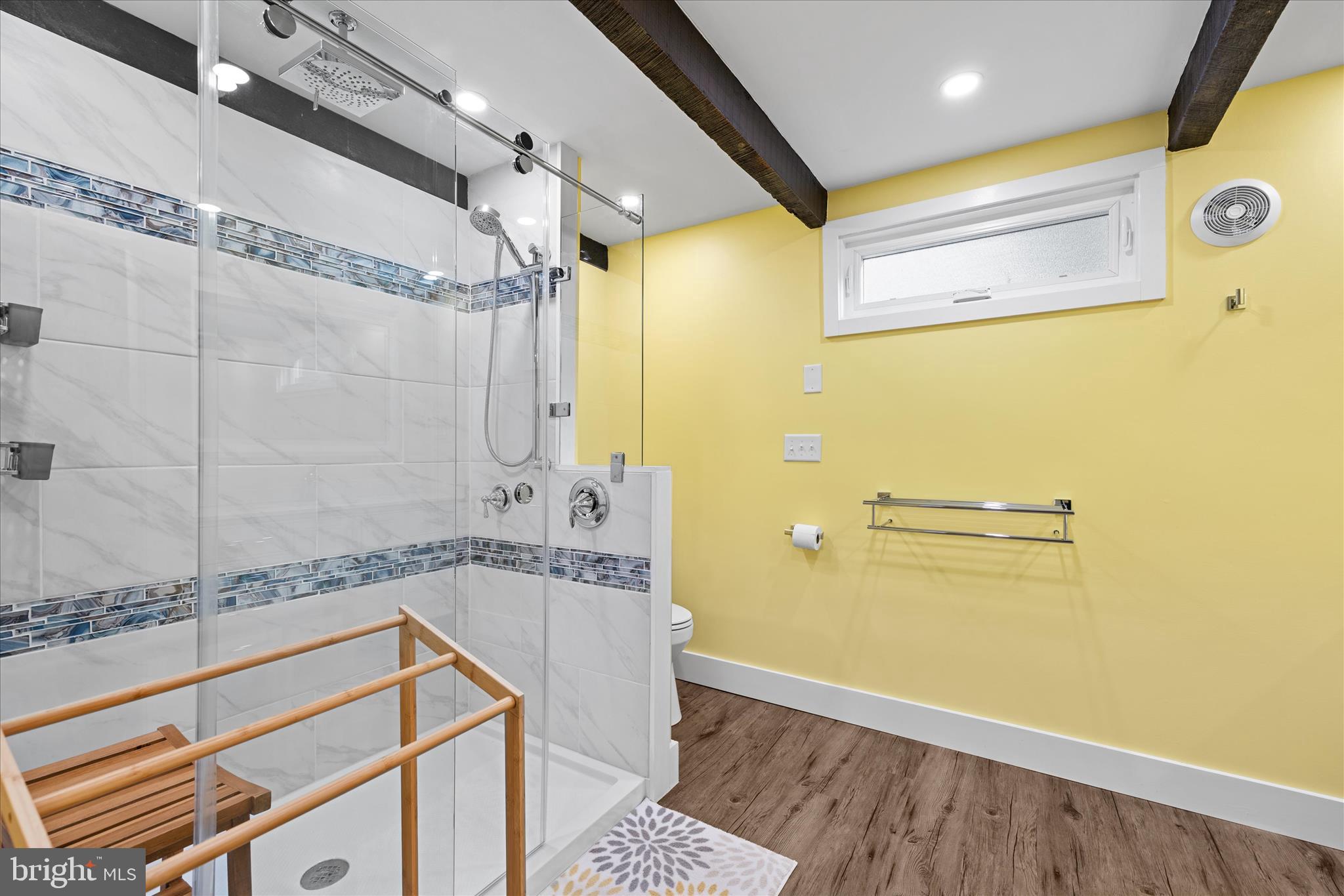 2 Bridge Road Bethany Beach, DE 19930 - Photo 24 of 65 a bathroom with a granite countertop sink a mirror and shower