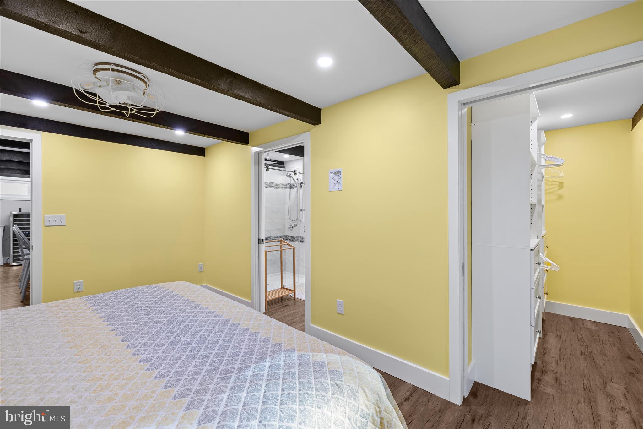 2 Bridge Road Bethany Beach, DE 19930 - Photo 26 of 65 a bedroom with a bed and wooden floor