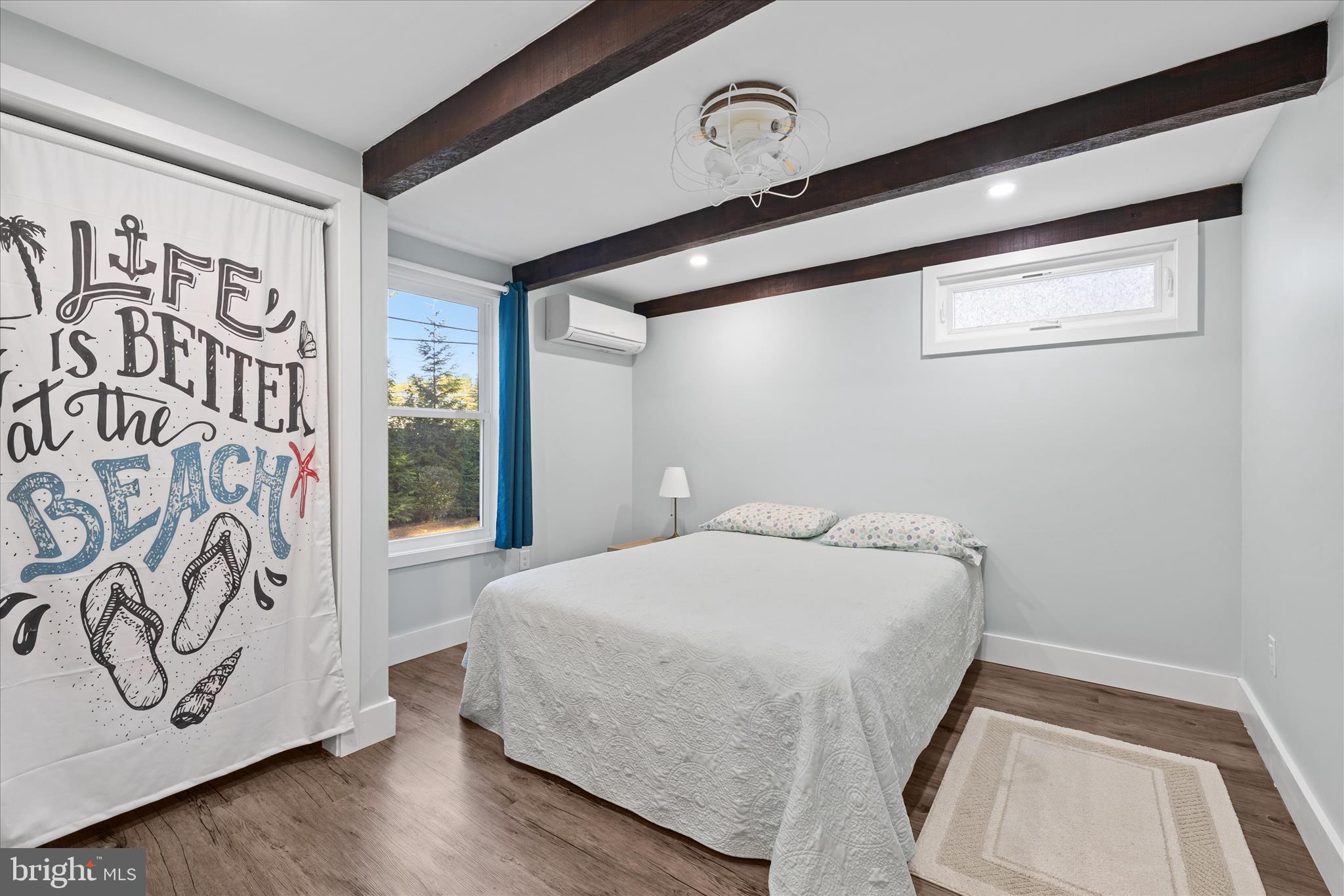 2 Bridge Road Bethany Beach, DE 19930 - Photo 28 of 65 a bedroom with a bed and a window