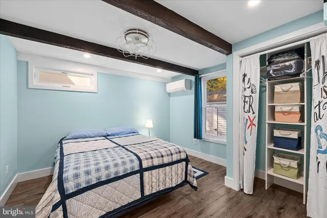 a backyard of a house with a large tree