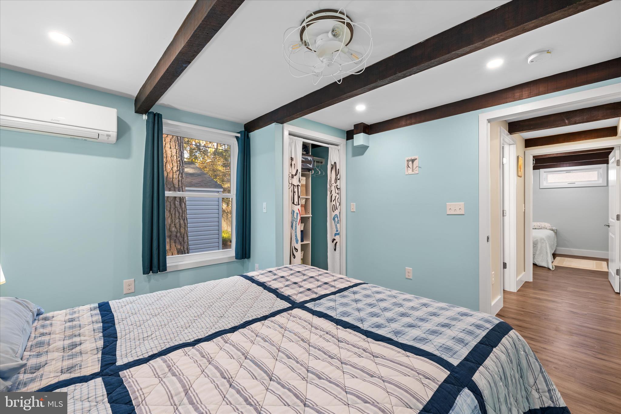 2 Bridge Road Bethany Beach, DE 19930 - Photo 33 of 65 a bedroom with a bed and a large mirror