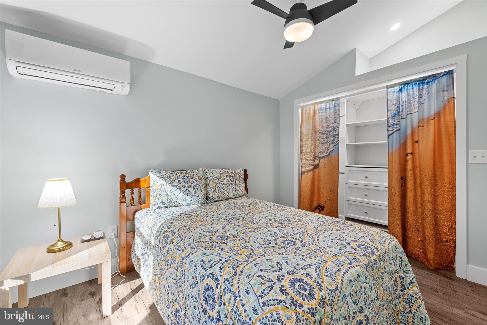 2 Bridge Road Bethany Beach, DE 19930 - Photo 34 of 65 a bedroom with a bed and wooden floor