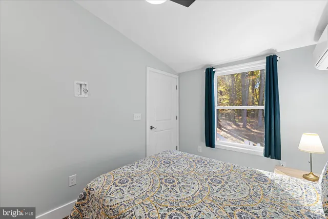 front view of a house with a large trees