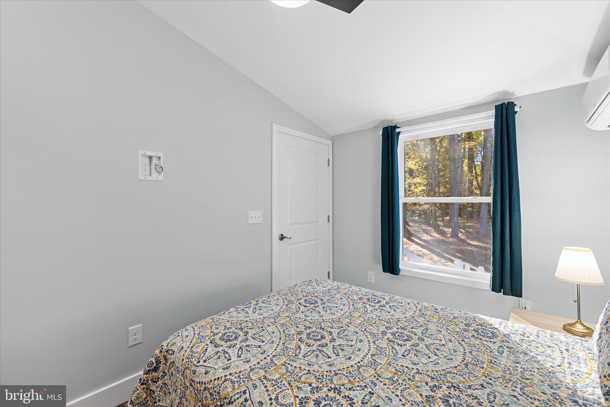 2 Bridge Road Bethany Beach, DE 19930 - Photo 35 of 65 a bedroom with a bed and a lamp