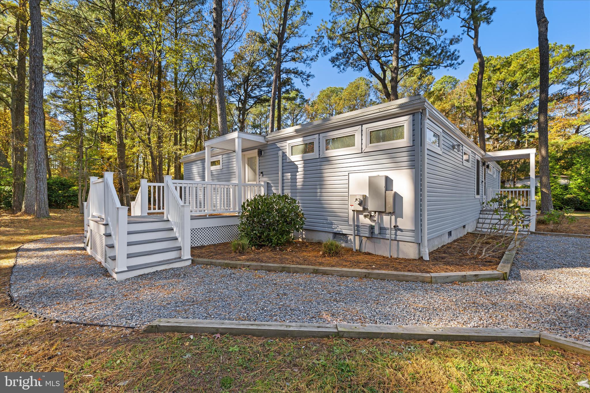 2 Bridge Road Bethany Beach, DE 19930 - Photo 37 of 65 a front view of a house with a yard