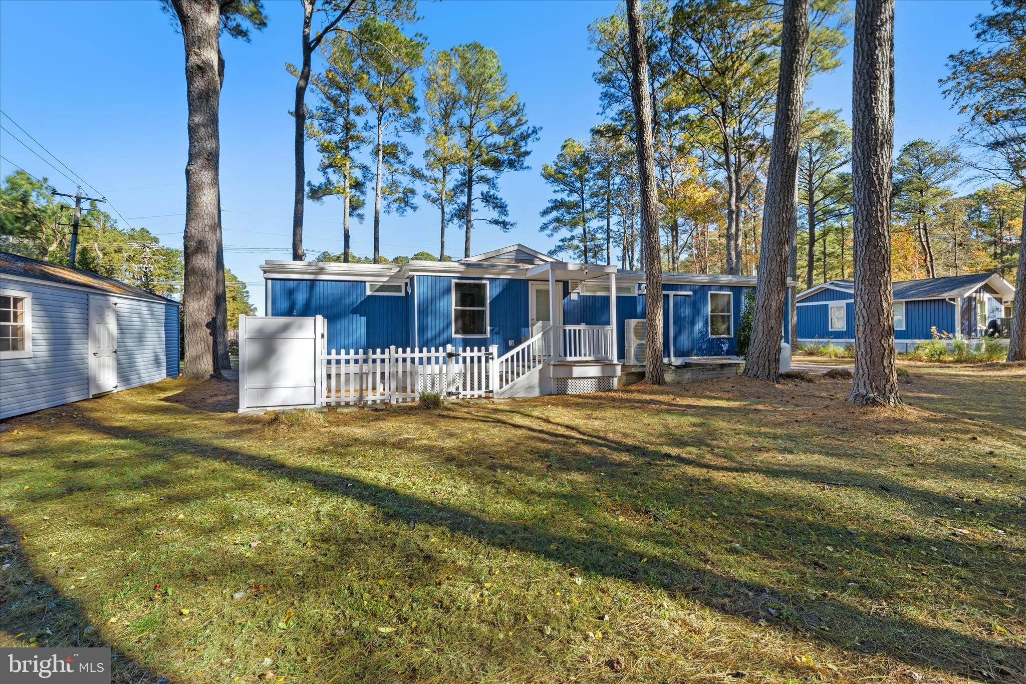 2 Bridge Road Bethany Beach, DE 19930 - Photo 39 of 65 a swimming pool with outdoor seating and yard