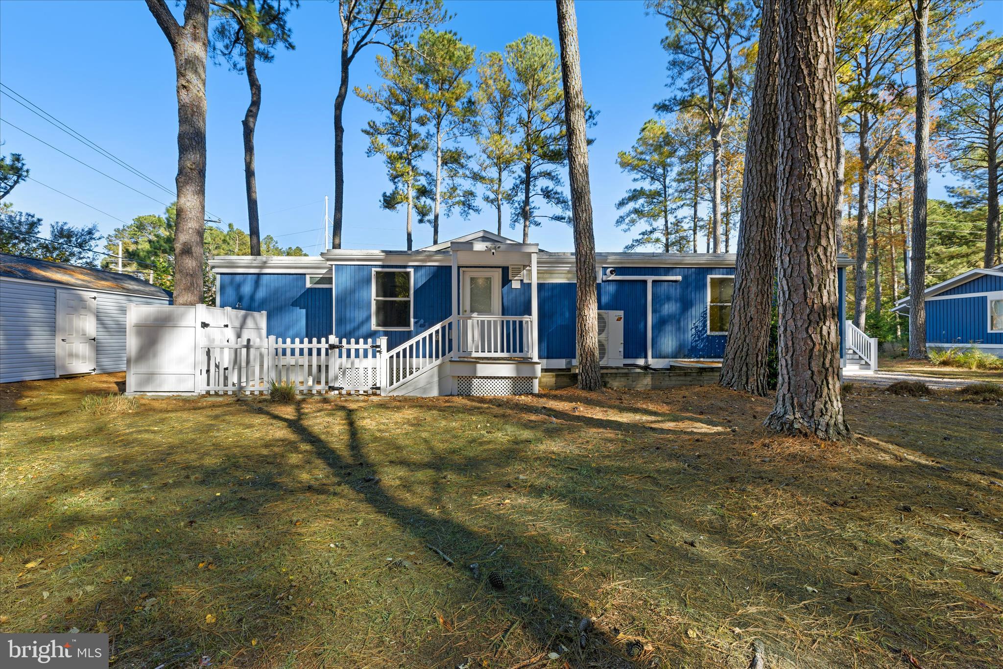 2 Bridge Road Bethany Beach, DE 19930 - Photo 40 of 65 front view of a house with a large trees