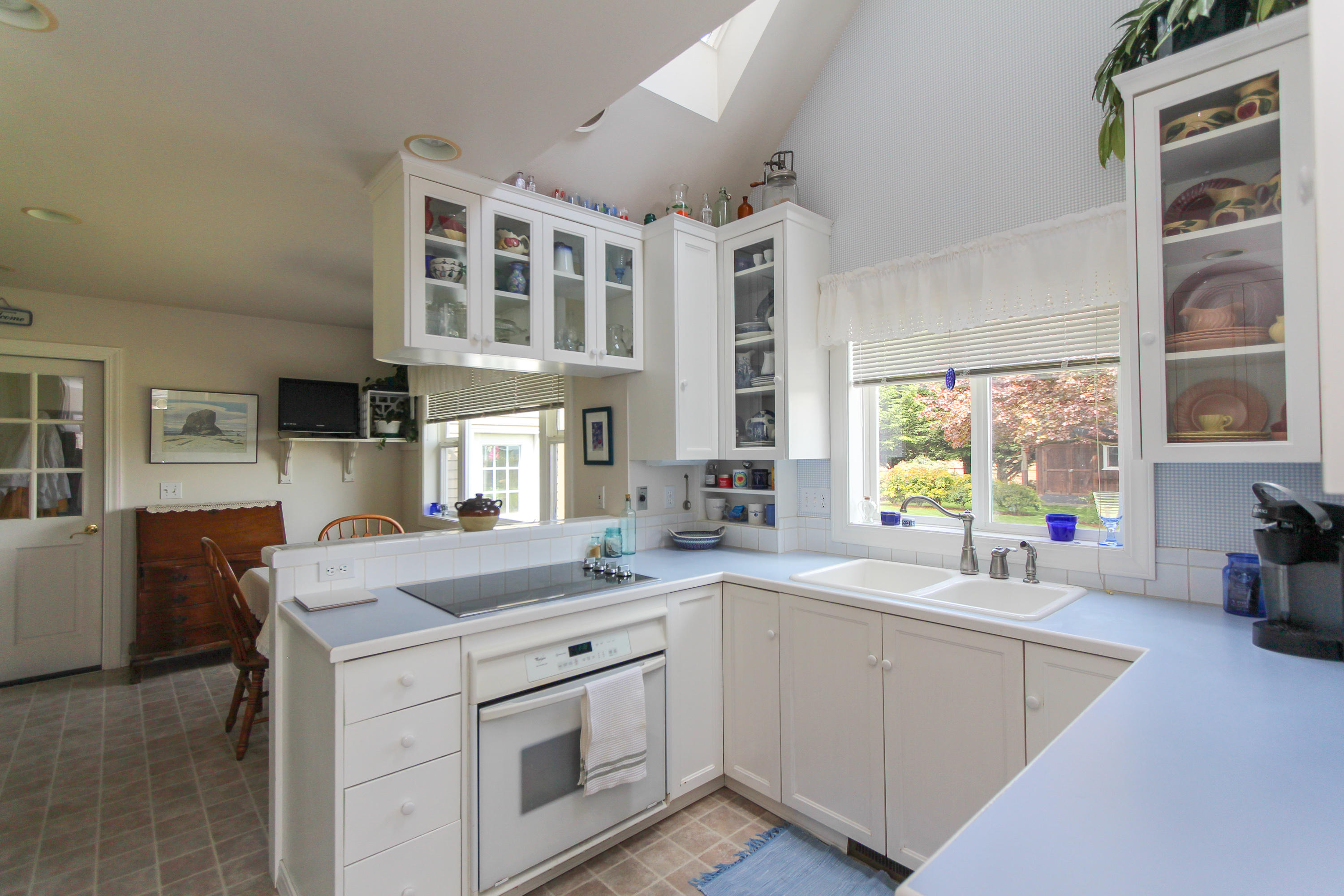 3225 Fitzpatrick Road Tillamook, OR 97141 - Photo 14 of 50 a kitchen that has a sink and a stove in it