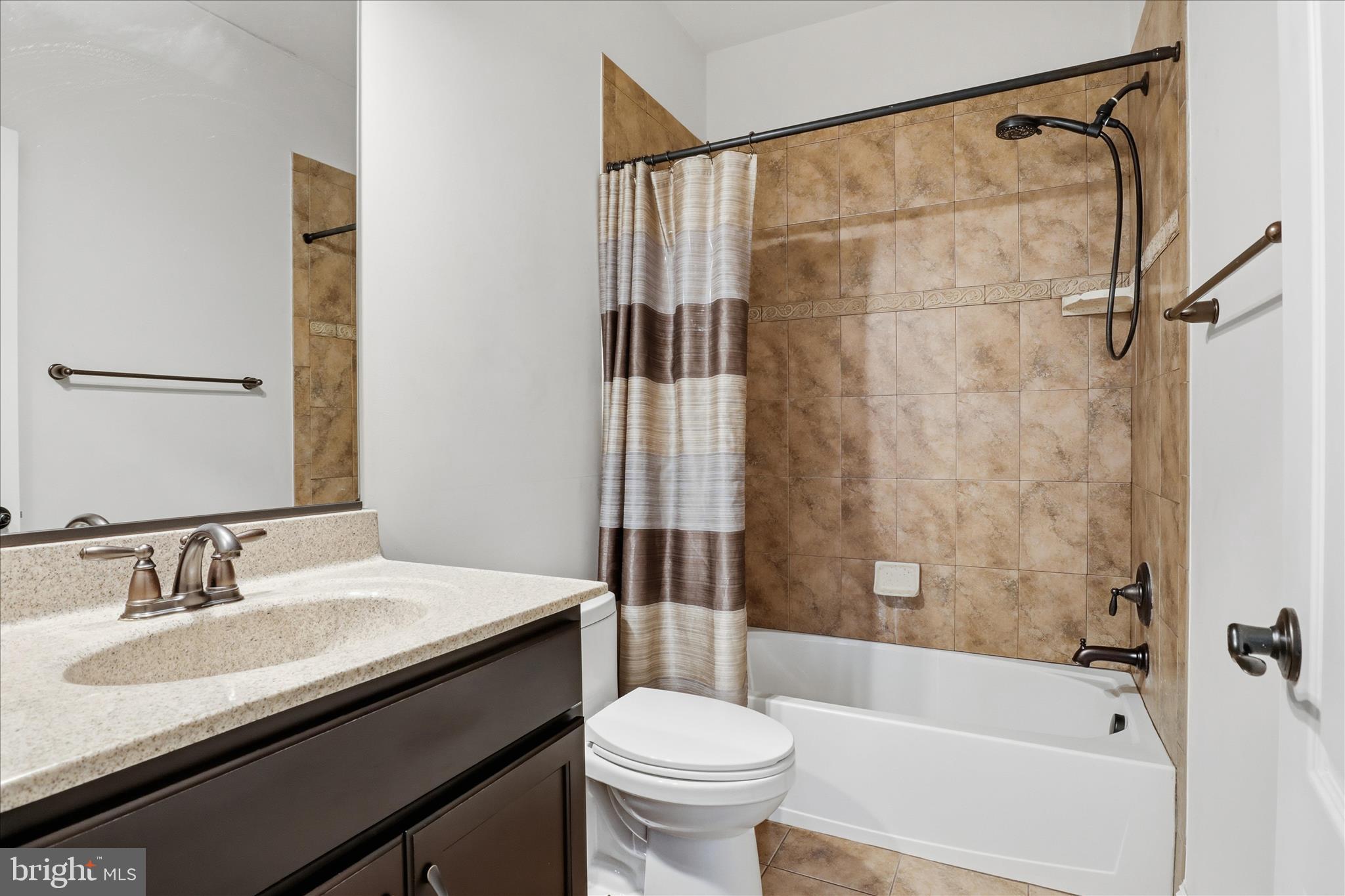 7501 Clifton Road Clifton, VA 20124 - Photo 41 of 93 a bathroom with a sink and a mirror