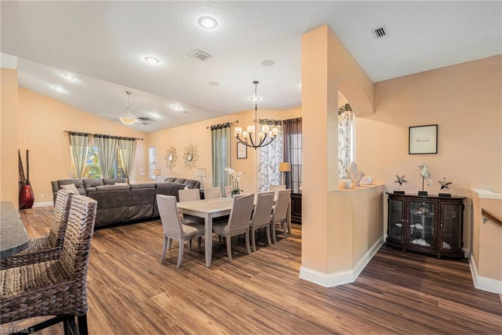 1316 Apollo Beach Boulevard South Apollo Beach, FL 33572 - Photo 12 of 47 a view of a dining room with furniture window and wooden floor