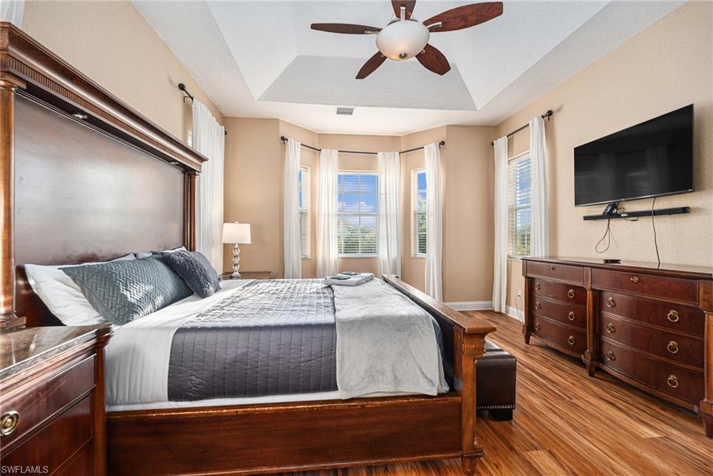 1316 Apollo Beach Boulevard South Apollo Beach, FL 33572 - Photo 16 of 47 a bedroom with a bed and a flat screen tv