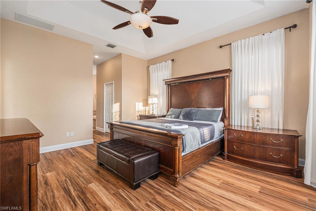 1316 Apollo Beach Boulevard South Apollo Beach, FL 33572 - Photo 17 of 47 a bedroom with a bed and window