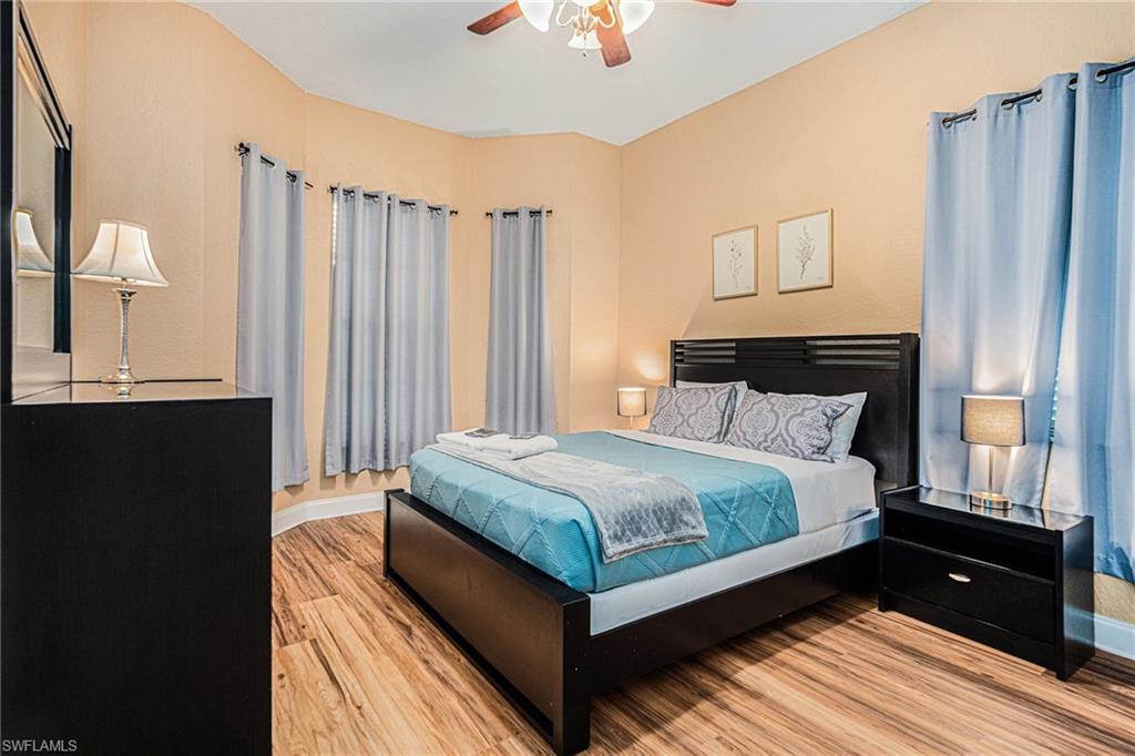 1316 Apollo Beach Boulevard South Apollo Beach, FL 33572 - Photo 19 of 47 a bedroom with a bed and a window