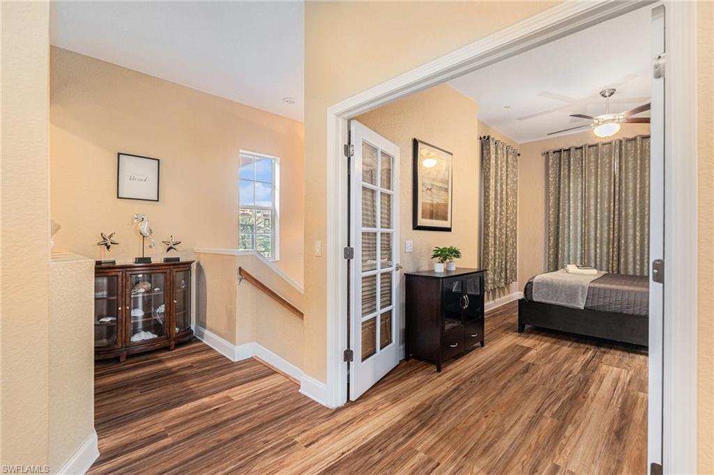 1316 Apollo Beach Boulevard South Apollo Beach, FL 33572 - Photo 21 of 47 a living room with furniture and a wooden floor