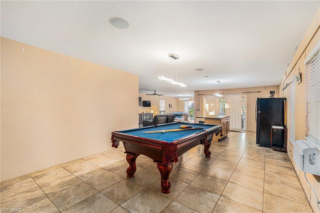 1316 Apollo Beach Boulevard South Apollo Beach, FL 33572 - Photo 27 of 47 a room with furniture and a table