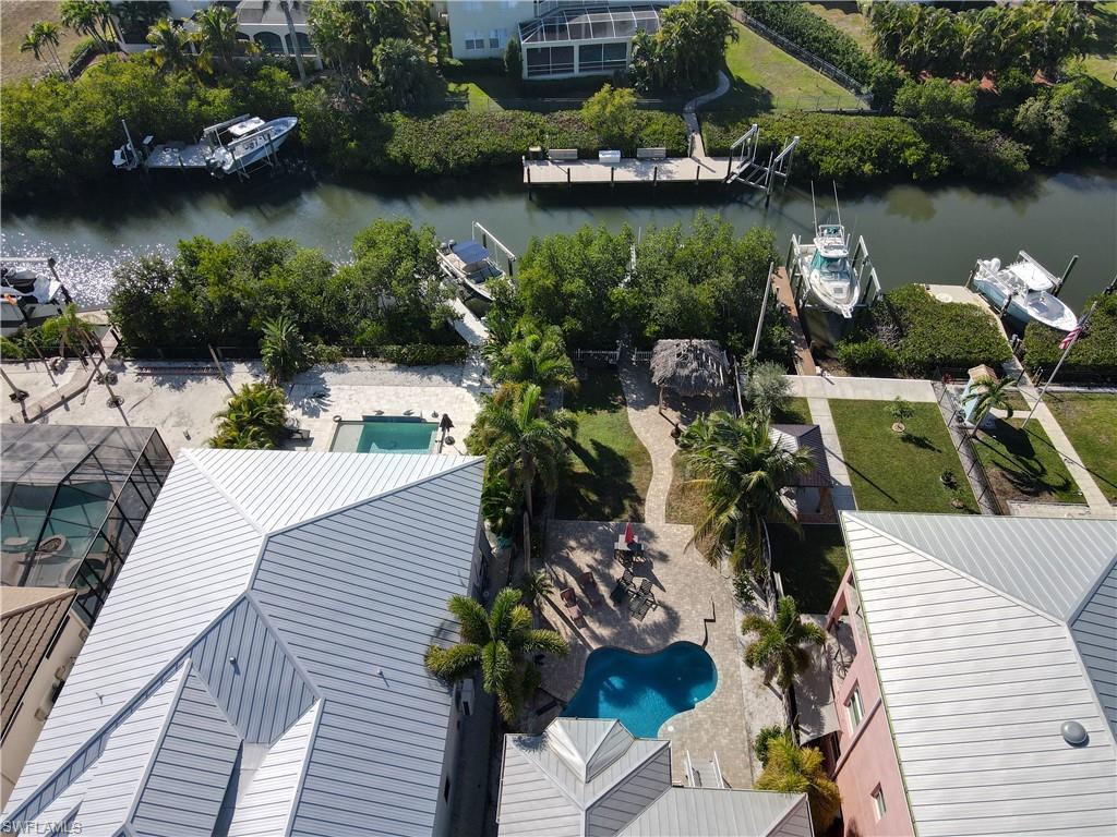 1316 Apollo Beach Boulevard South Apollo Beach, FL 33572 - Photo 43 of 47 an aerial view of a house with outdoor seating and lake view