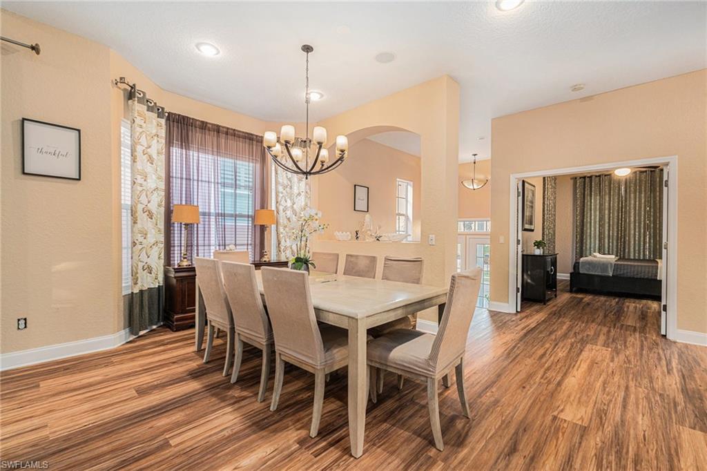 1316 Apollo Beach Boulevard South Apollo Beach, FL 33572 - Photo 10 of 47 a view of a dining room with furniture window and wooden floor