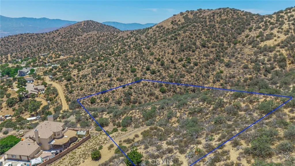 0 Clayvale Acton, CA 93510 - Photo 3 of 17 a large stone wall with a mountain in the back