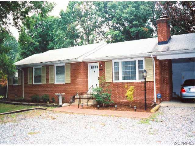 9716 Reams Road Richmond, VA 23236 - Photo 1 of 1 a front view of a house with a yard and garage