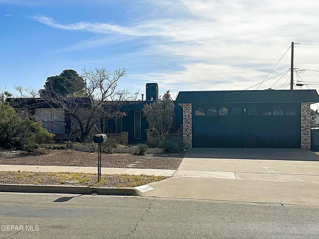 a front view of a building with parking space