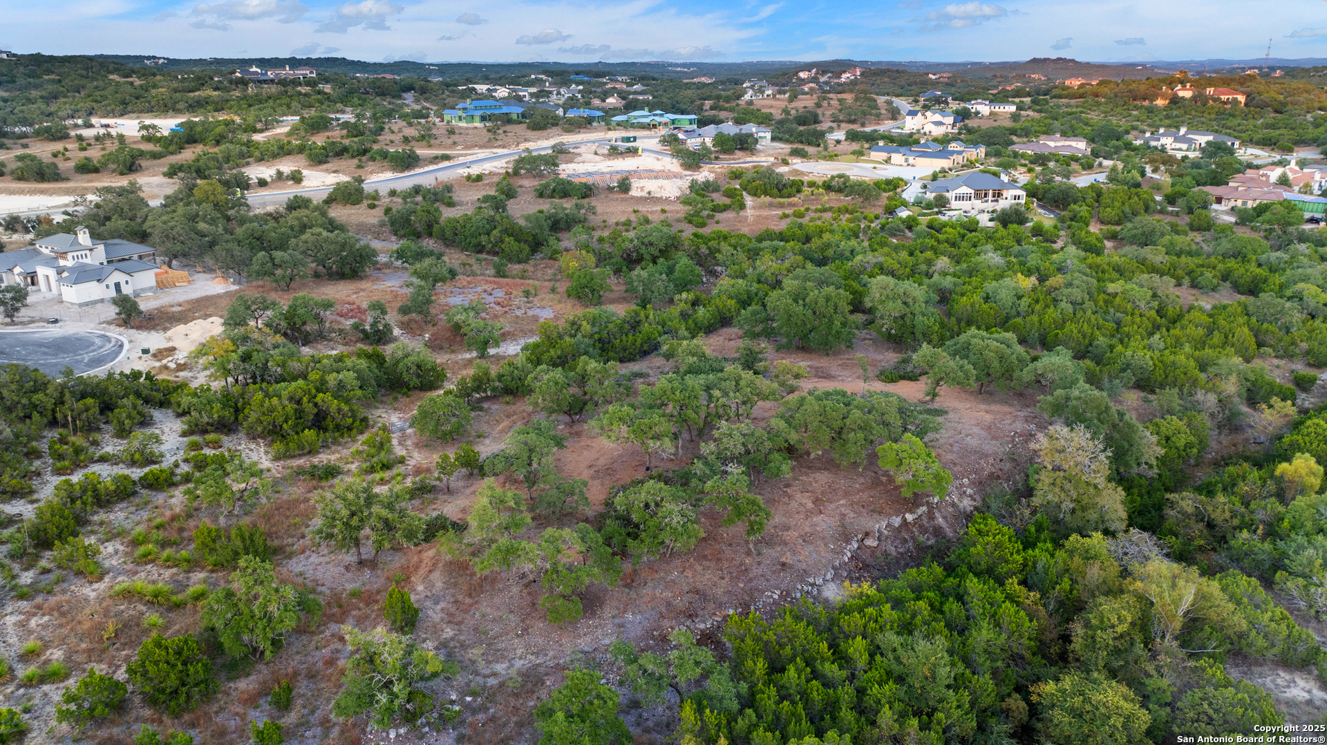 25722 Eden Point Boerne, TX 78006 - Photo 34 of 46 an aerial view of residential houses with outdoor space and trees