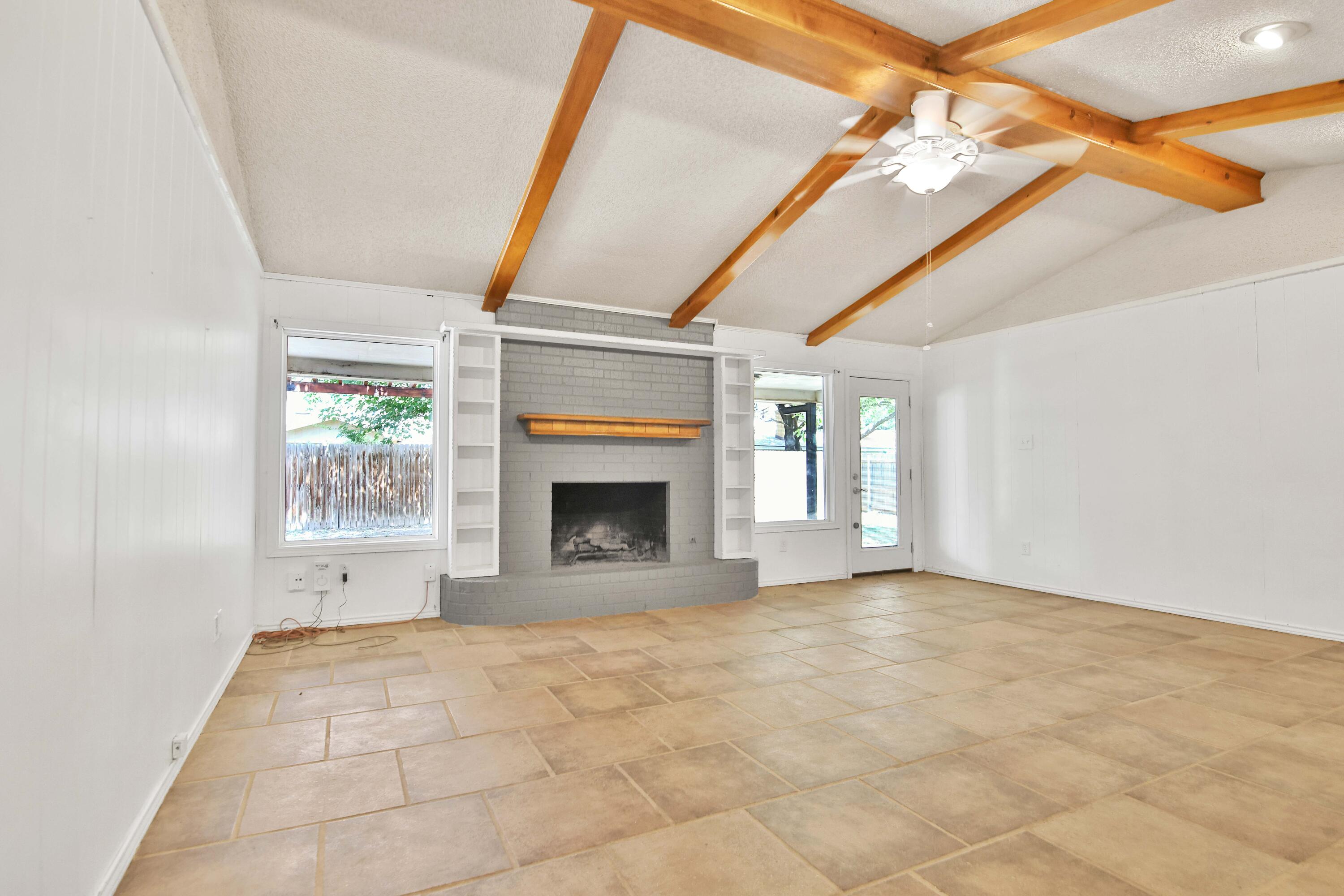 4818 73rd Street Lubbock, TX 79424 - Photo 23 of 31 a view of empty room with a fireplace