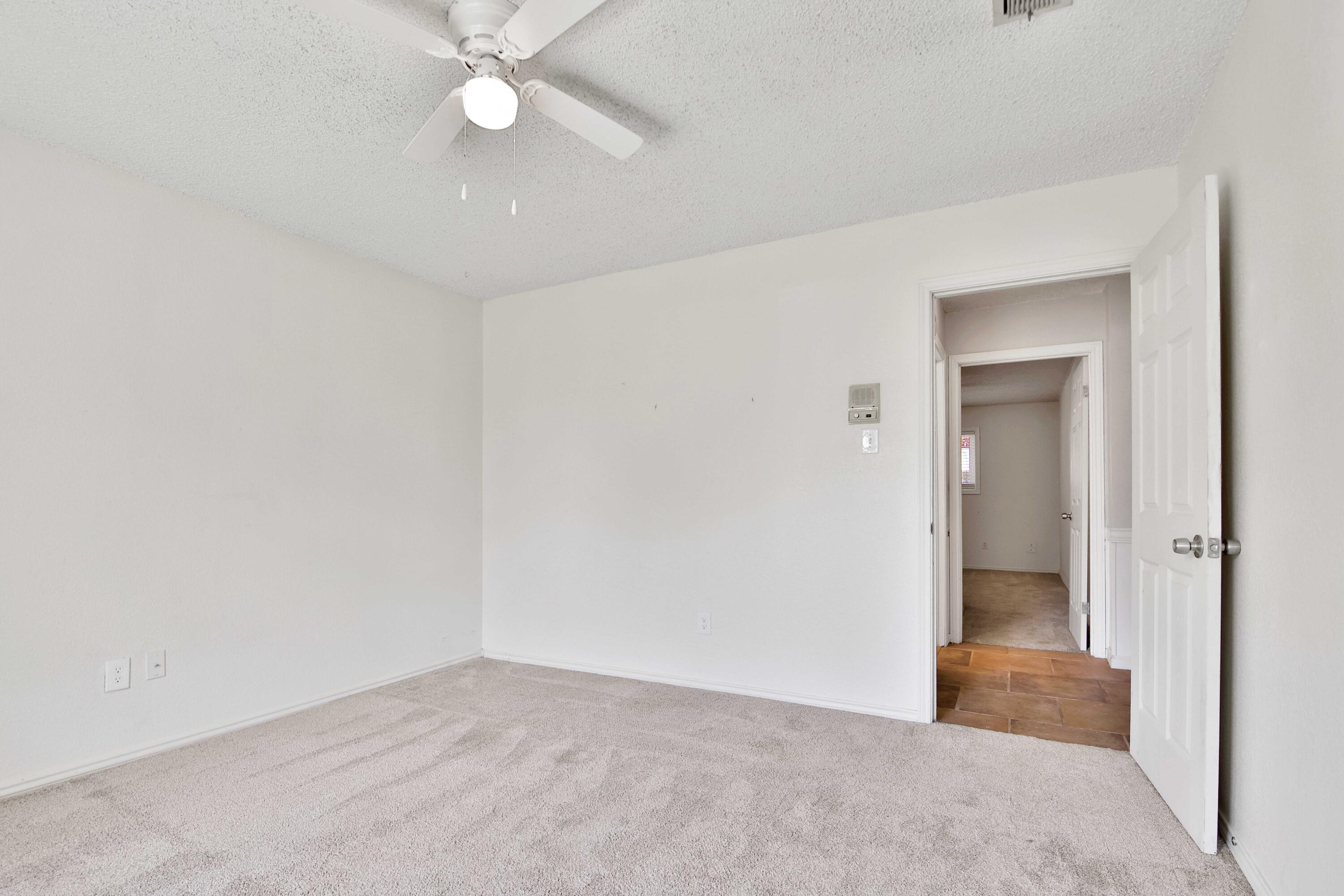 4818 73rd Street Lubbock, TX 79424 - Photo 25 of 31 an empty room with closet and fan