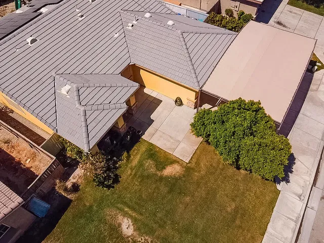 an aerial view of residential houses with outdoor space