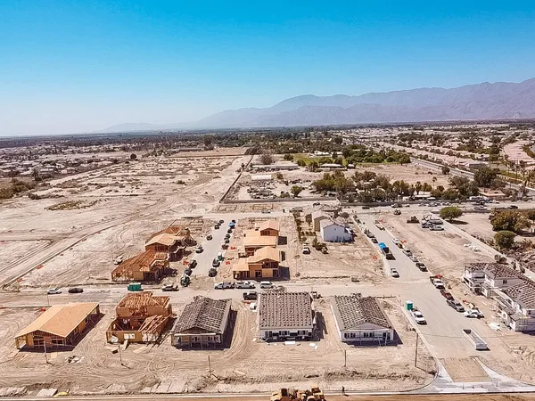 a living room with a bed and a dresser