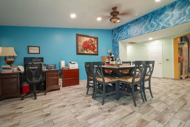 a view of a livingroom with furniture and a fireplace