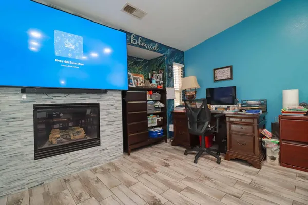a view of a livingroom with furniture wooden floor and a window
